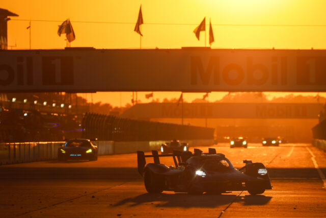 Race cars on a sunlit track at sunset beneath a Mobil 1 banner.