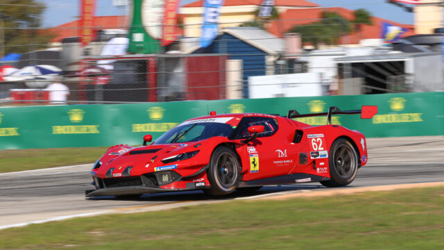 Red Ferrari race car #62 speeding along the track with sponsor decals visible and motion blur in the background for a race event.